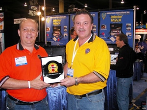 Tom Gough at a Tradeshow accepting PTEN Award